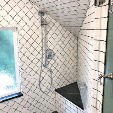 Enlarged shower with corner quartz bench and matching quartz windowsill and tile surround