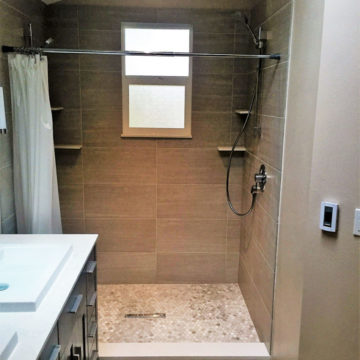 New double shower with tile surround marble shower floor and matching quartz windowsill corner shelving shower threshold