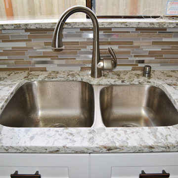 New sink and faucet tile backsplash and quartz countertop with matching quartz window sill