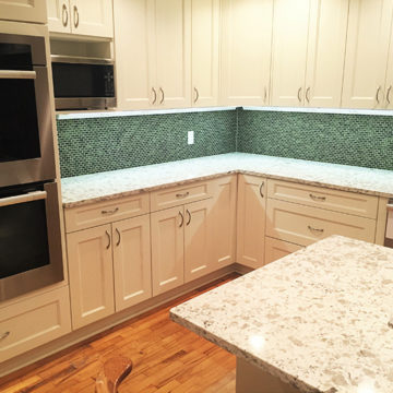 New tile backsplash quartz countertop and cabinets with LED lighting underneath