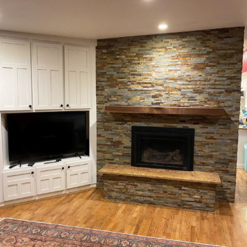Completed fireplace remodel new Heat n Glo insert,-stacked-stone,-and-custom-walnut-mantel