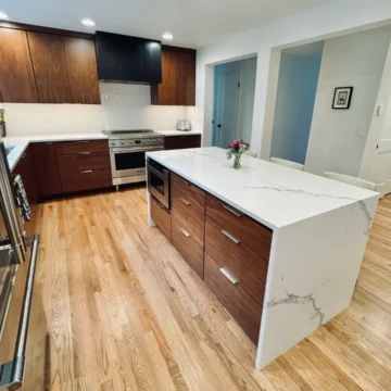 Custom island with waterfall countertops